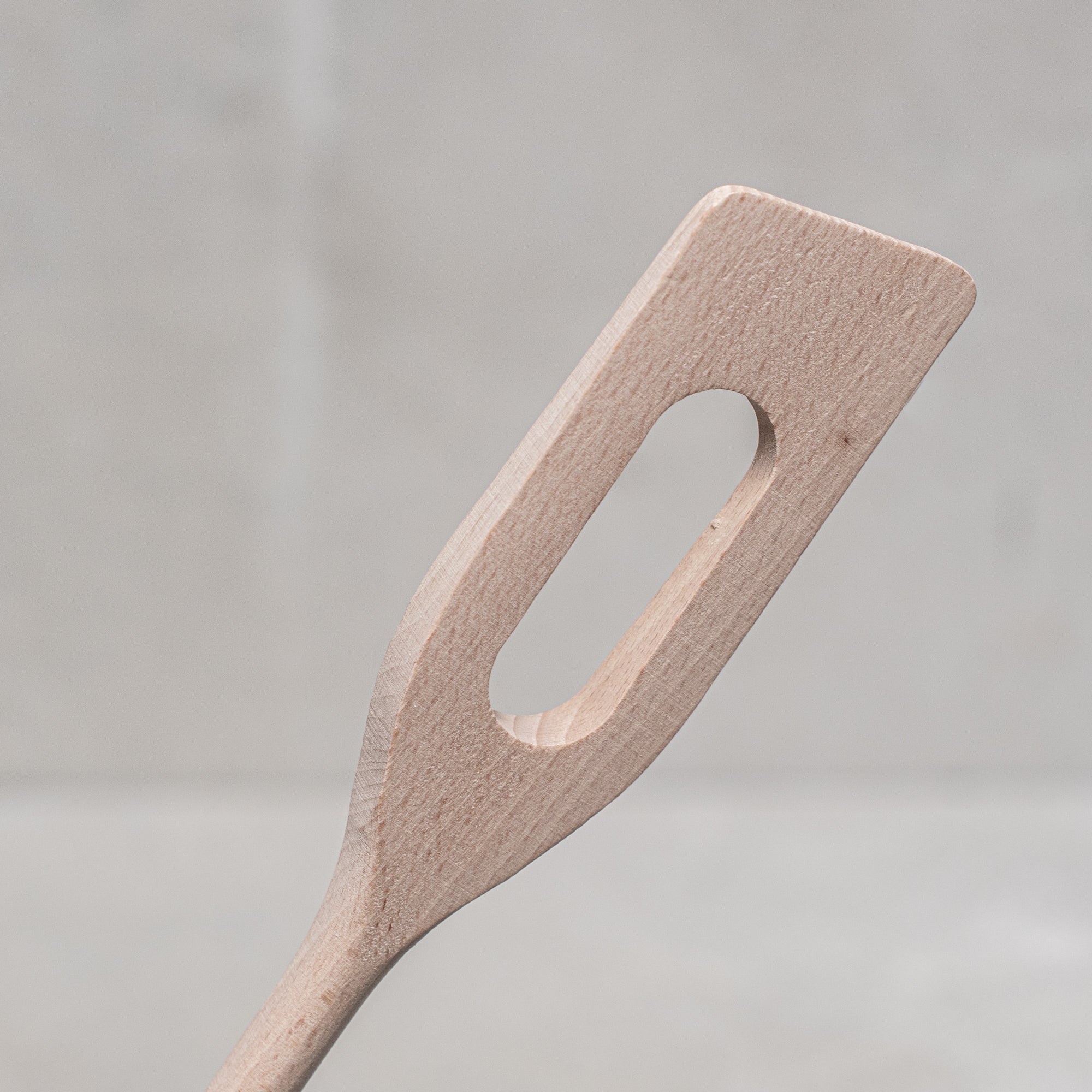 Heaven in Earth German-made wooden spatula stirrer, crafted from high-quality, durable wood with a smooth finish. Ideal for stirring, mixing, and scraping in the kitchen, this eco-friendly tool offers a sleek, functional design that's gentle on cookware and perfect for everyday use