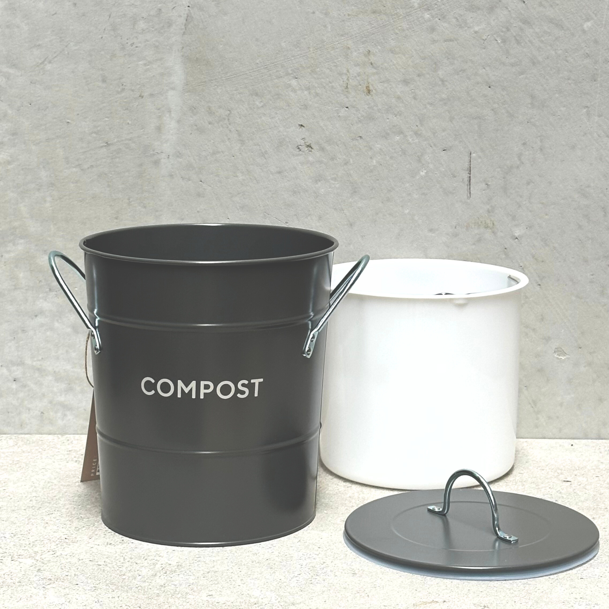 Heaven in Earth metal compost bin, featuring a sleek, durable design perfect for collecting kitchen scraps and creating nutrient-rich compost.