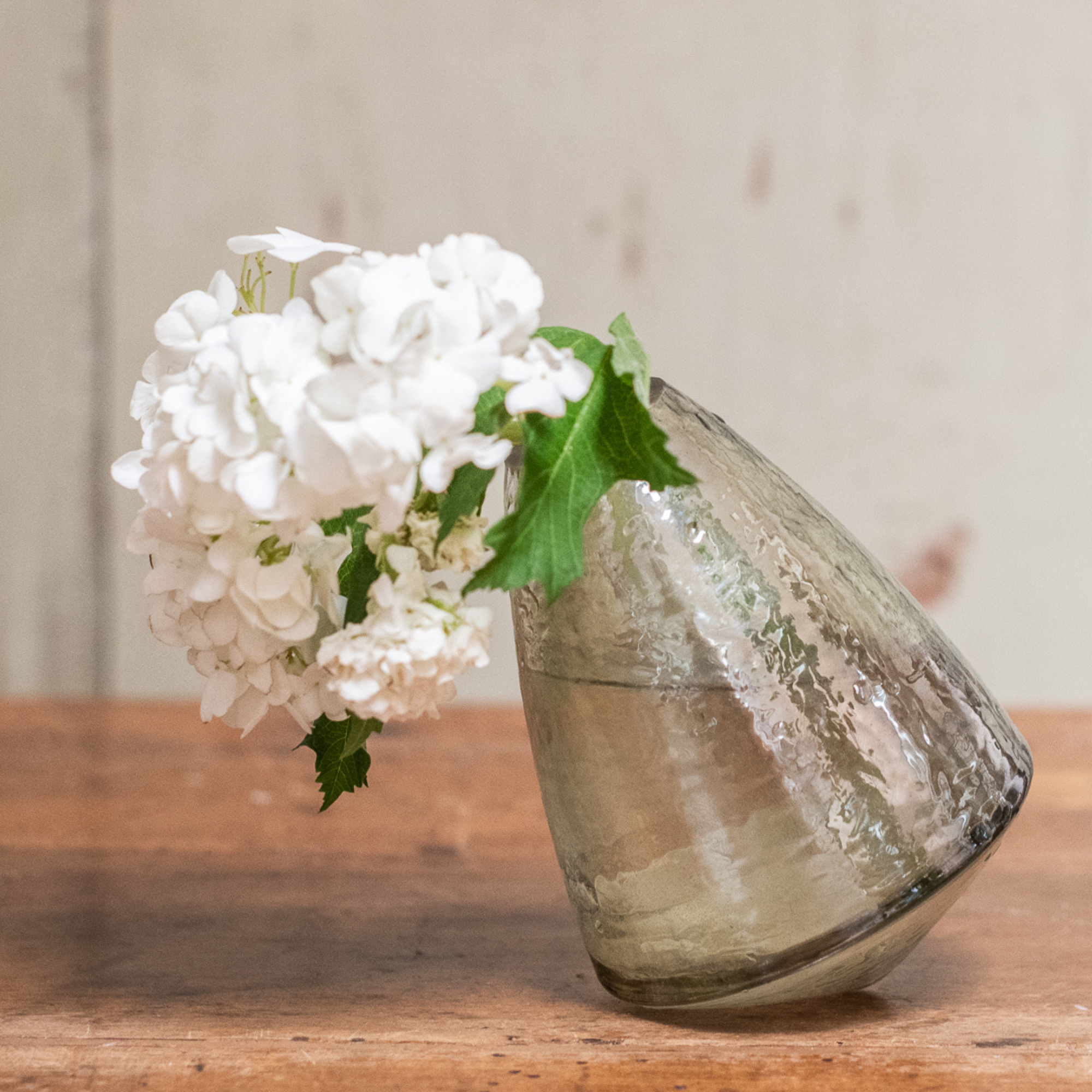 Conical glass wobble vase used as reed diffuser
