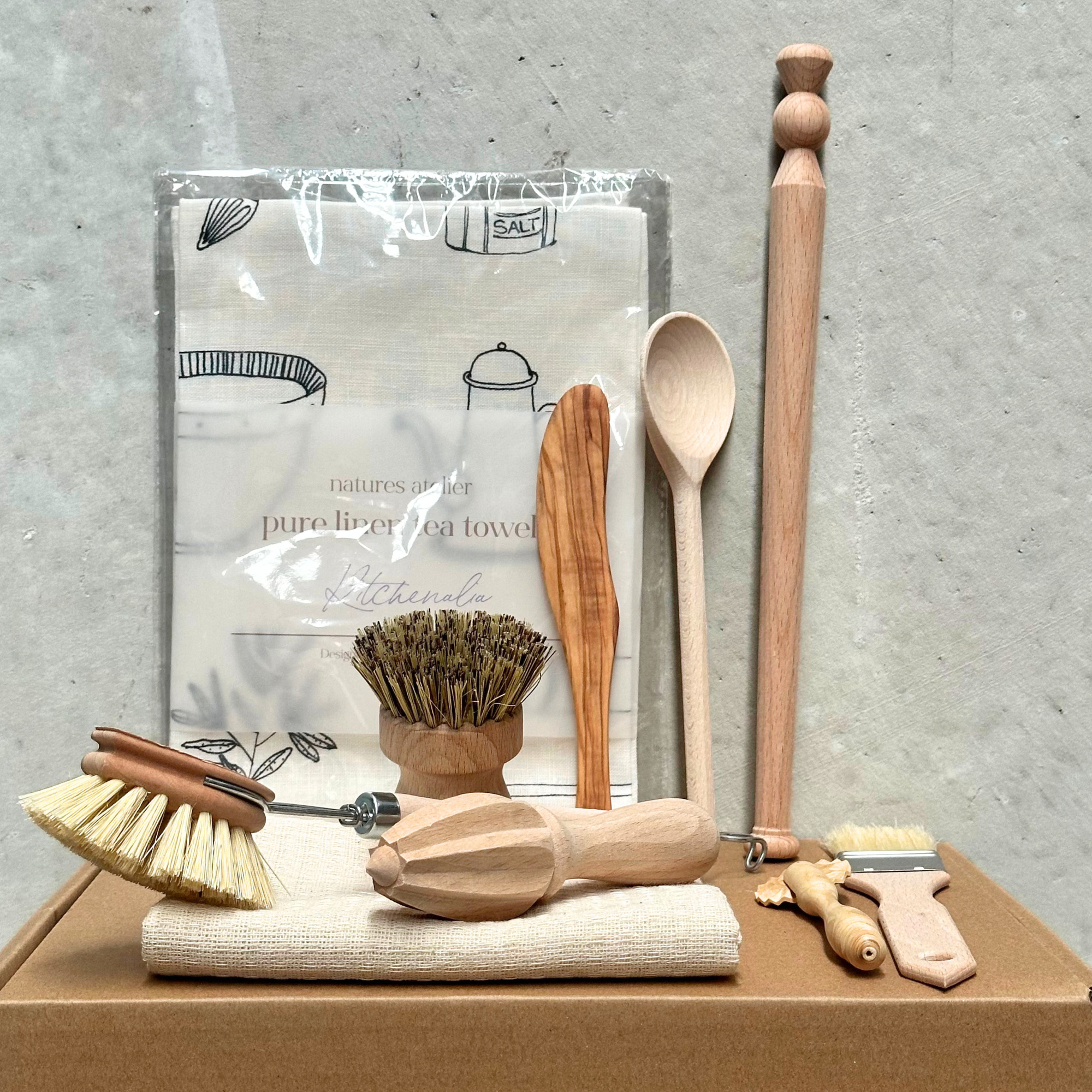 Cook’s gift set ($100) featuring a collection of high-quality kitchen essentials: a wooden dish brush, spurtle, pot and pan brush, lemon reamer, boxwood pastry cutter, olive wood butter knife, and a wooden spoon. Perfect for anyone who loves cooking with sustainable, handcrafted tools. Heaven In Earth HIE