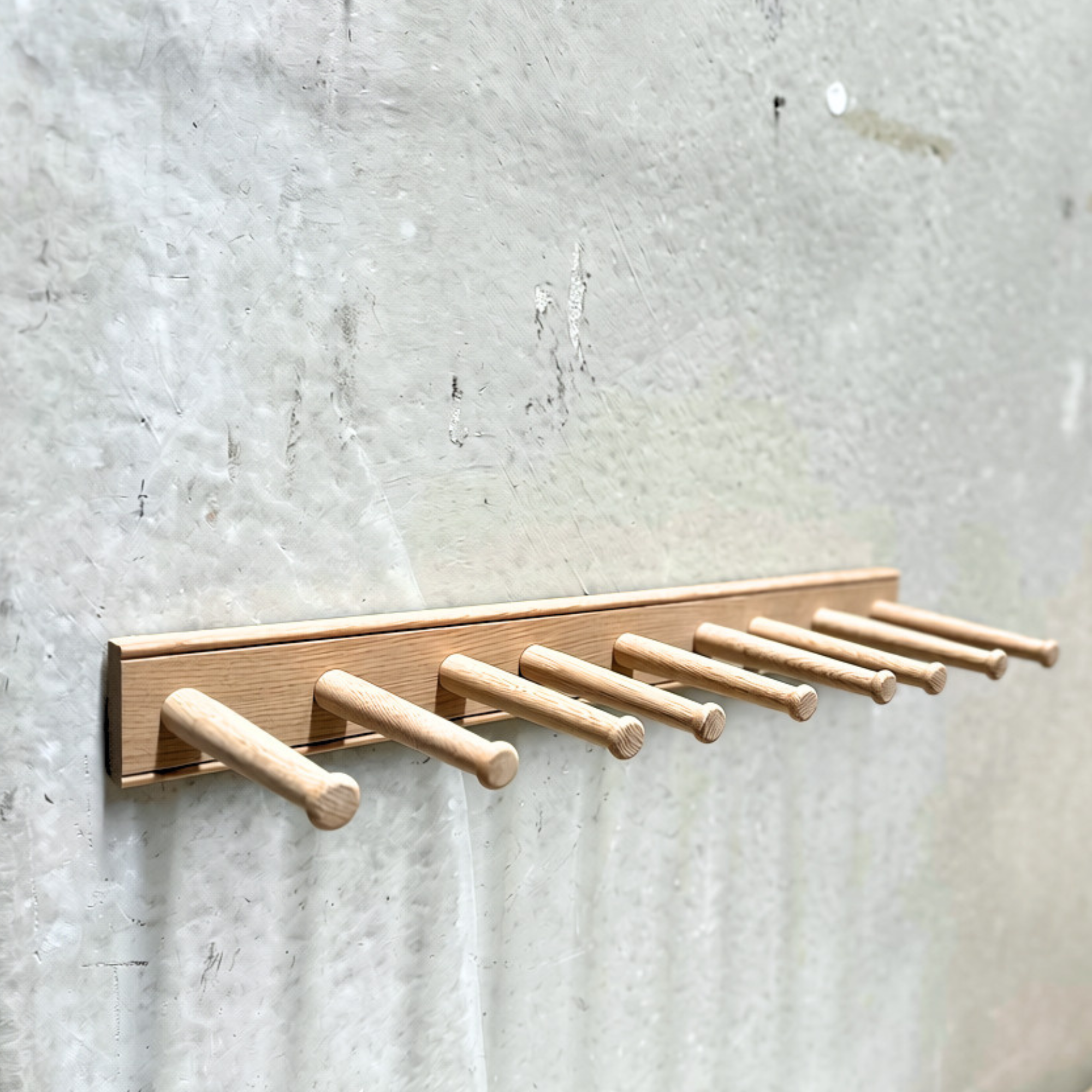 Natural oak wall-mounted boot rack holding up to three pairs of boots by Creamore Mill.