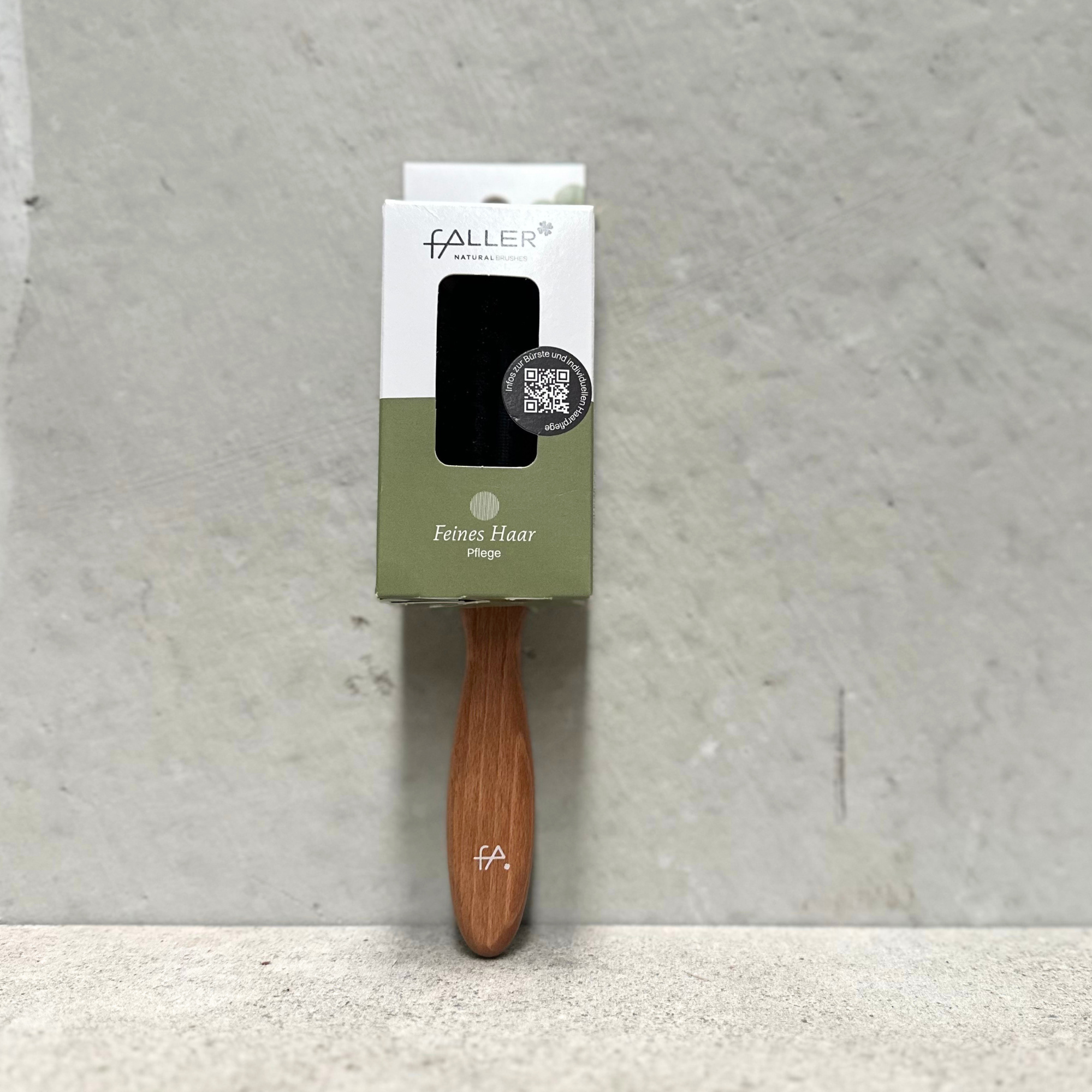 Long natural bristle hair brush with beechwood handle for fine hair by Faller Germany.