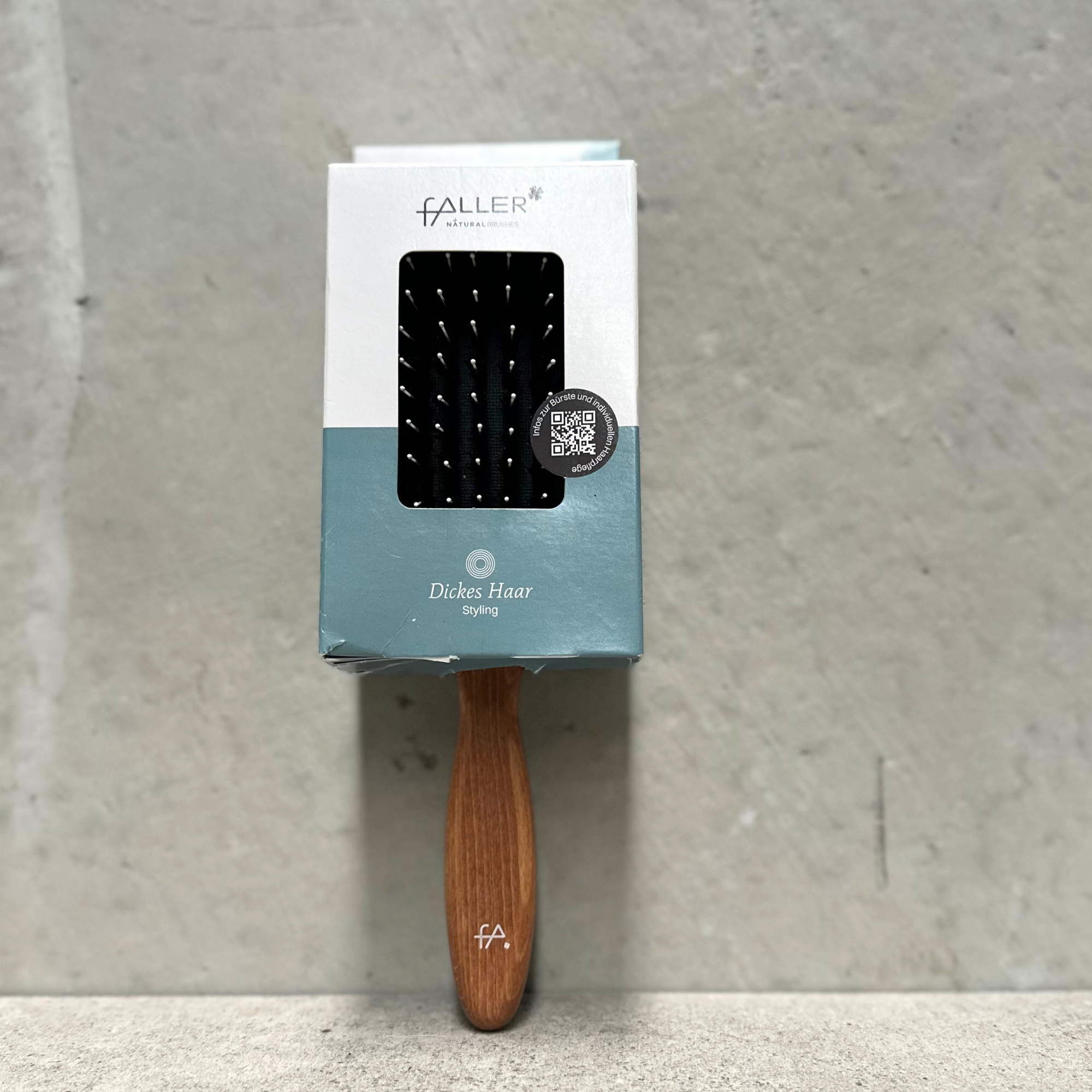 Paddle pin hair brush with natural bristles, rounded nylon pins and beechwood handle for thick hair by Faller Germany.