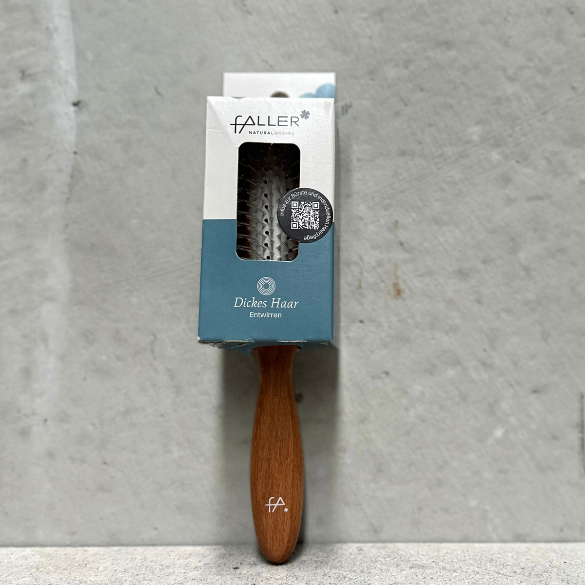Vegan steel pin detangling brush with rounded steel pins and beechwood handle for thick hair by Faller Germany.