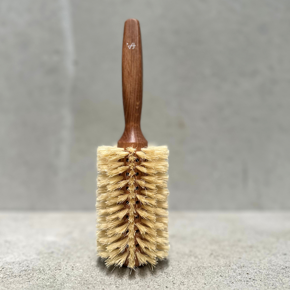 Round vegan hair brush with beechwood handle and vegan fibre bristles for fine hair by Faller Germany.