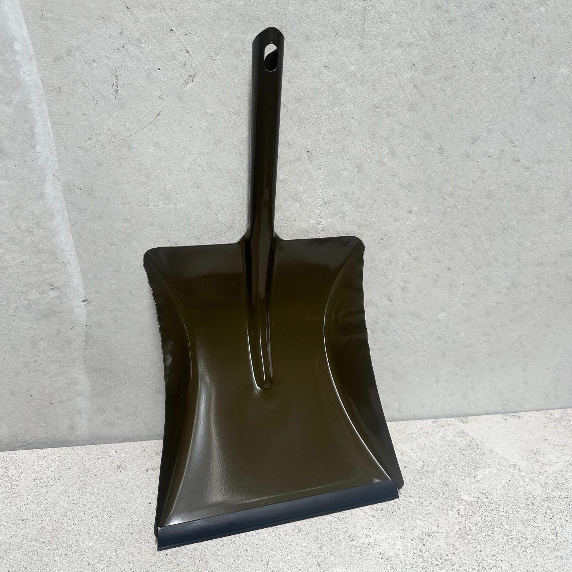 Heaven in Earth (HIE) olive metal dustpan, made in Germany, featuring a sleek, sturdy metal design with a unique olive finish and a comfortable handle, perfect for efficient cleaning with a touch of elegance