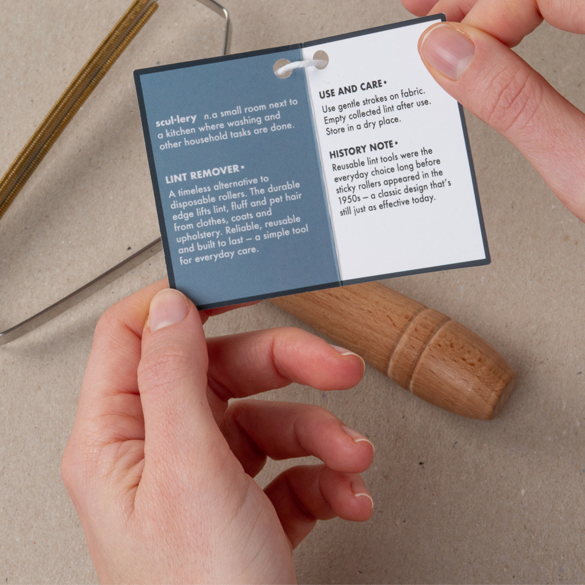 Wooden handle metal lint remover