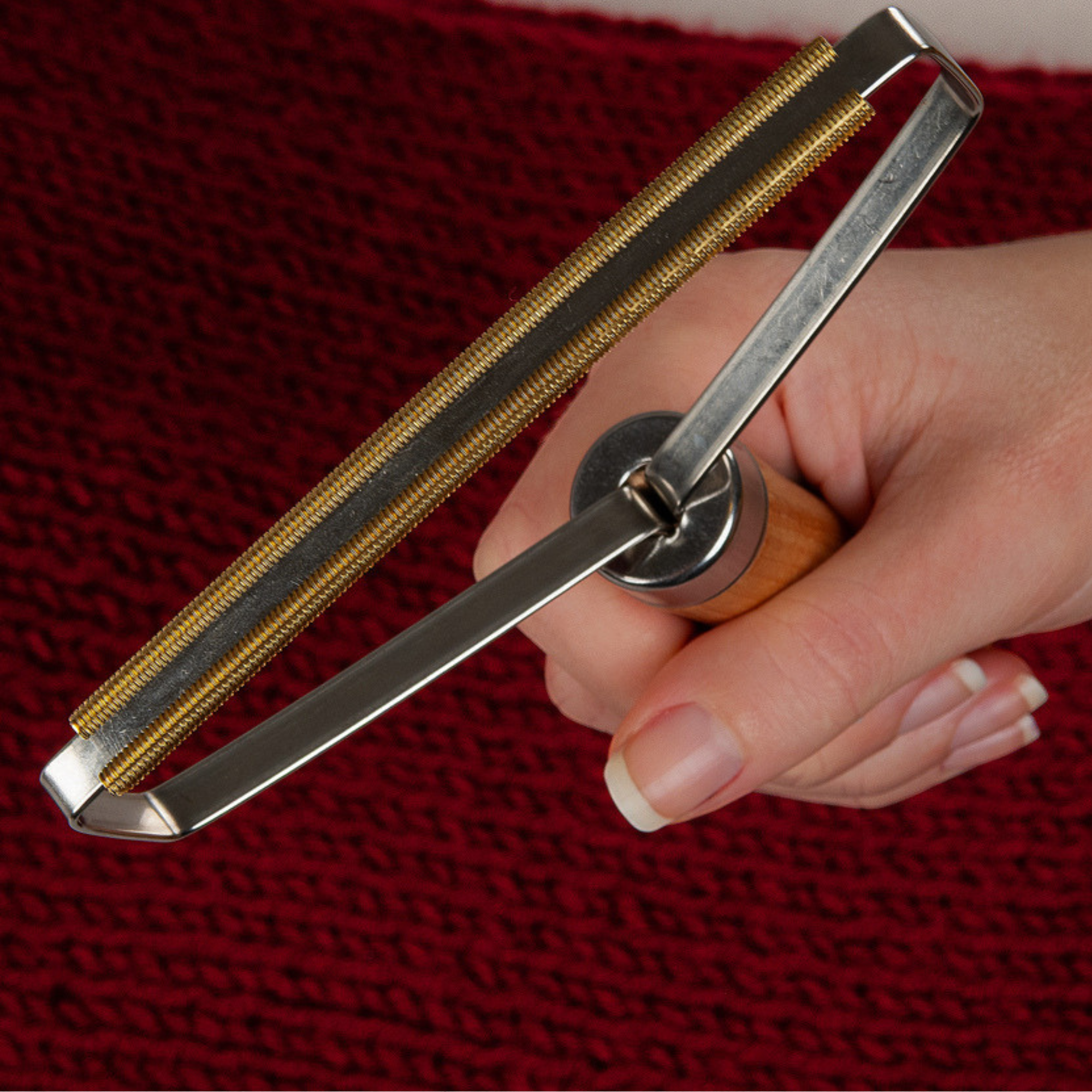 Wooden handle metal lint remover
