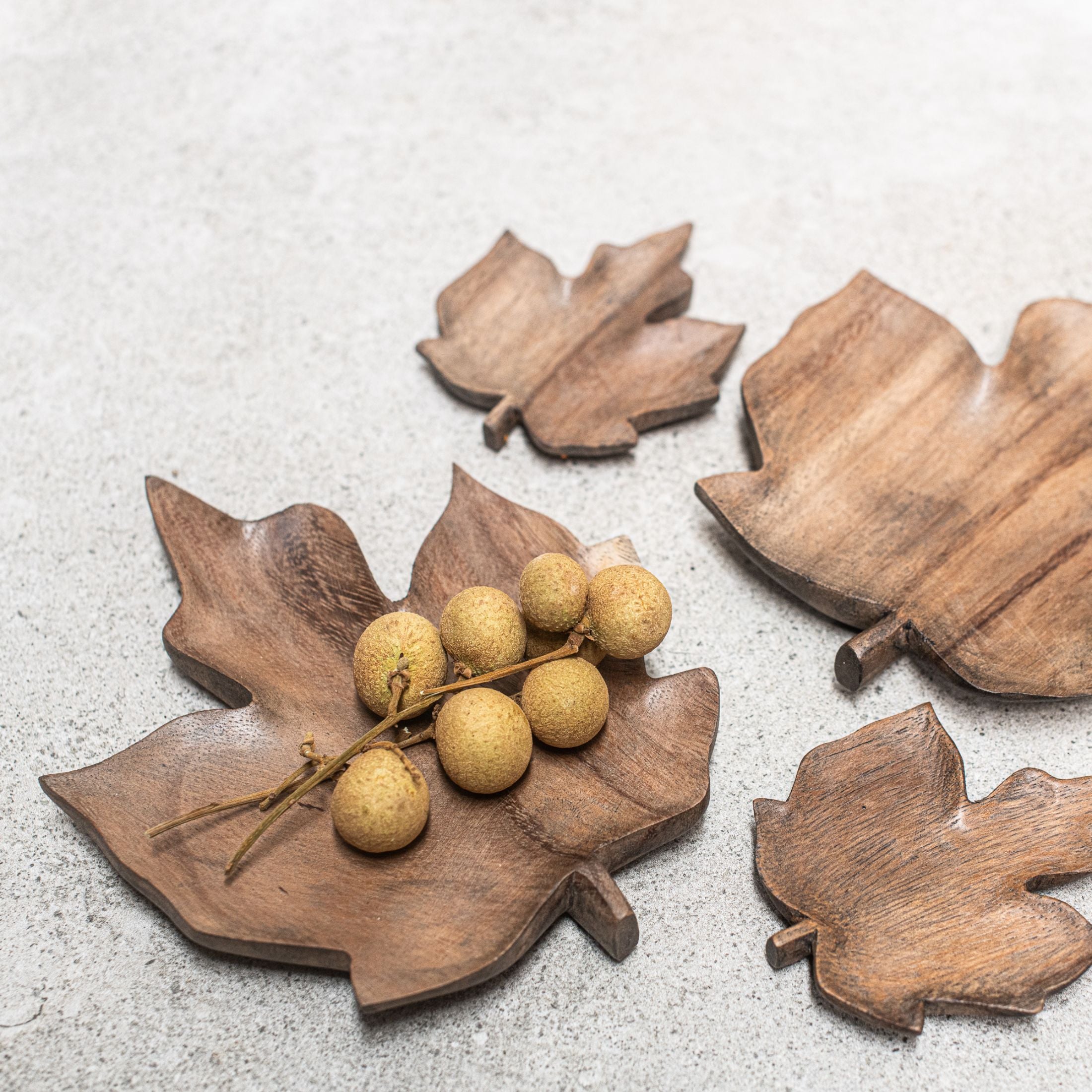 Gorgeous East of India wooden flat leaf dishes, perfect for adding decorative warmth and natural beauty to any interior. Use as a statement piece, layer the smaller ones for a unique arrangement, or as a safe, stylish spot to hold special items. Heaven in Earth (HIE)